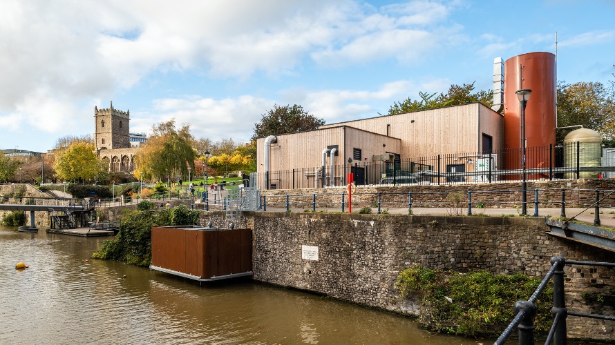 Castle Park Energy Centre on the side of the floating harbour, with blue sky above