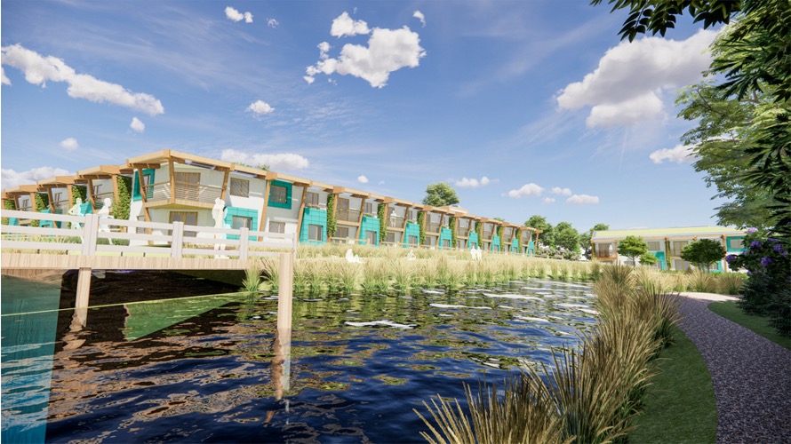 CGI image that shows the winning design. A low rise housing block with a raised wooden walkway running across a lake that is next to the building. Turquoise and wood cladding with white paint. Reeds and trees on the right hand side next to the water. Blue sky